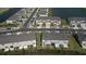Aerial view of townhouses community near a lake at 34196 Polacca Ln, Wesley Chapel, FL 33543