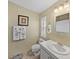 Clean bathroom with single sink vanity and shower/tub combo at 35921 Hermoso Ln, Zephyrhills, FL 33541