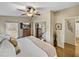 Spacious bedroom with king-size bed and mirrored closet at 35921 Hermoso Ln, Zephyrhills, FL 33541