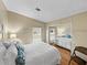 Bedroom with full-size bed and mirrored closet at 35921 Hermoso Ln, Zephyrhills, FL 33541
