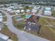 Aerial view of community clubhouse, pool, and shuffleboard at 35921 Hermoso Ln, Zephyrhills, FL 33541