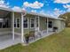 House exterior showcasing side entrance and patio at 35921 Hermoso Ln, Zephyrhills, FL 33541
