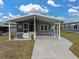 Single-wide manufactured home with carport and covered patio at 35921 Hermoso Ln, Zephyrhills, FL 33541