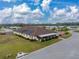 Aerial view of single Gathering home with solar panels and pool at 35921 Hermoso Ln, Zephyrhills, FL 33541