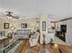 Open concept living room and kitchen with hardwood floors and neutral colors at 35921 Hermoso Ln, Zephyrhills, FL 33541