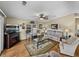 Living room features hardwood floors, fireplace, and comfortable seating at 35921 Hermoso Ln, Zephyrhills, FL 33541