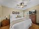 Spacious main bedroom with a king-size bed and ceiling fan at 35921 Hermoso Ln, Zephyrhills, FL 33541