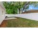 Large backyard with a patio and white fence at 3909 W La Salle St, Tampa, FL 33607