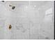 Clean shower with marble wall tiles and gold fixtures at 3909 W La Salle St, Tampa, FL 33607