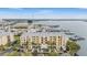 Aerial view of a waterfront condo building with boat slips at 425 150Th Ave # 2401, Madeira Beach, FL 33708