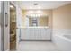 Double vanity bathroom with tub and shower at 425 150Th Ave # 2401, Madeira Beach, FL 33708
