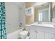 Clean bathroom with white vanity, bathtub, and shower at 425 150Th Ave # 2401, Madeira Beach, FL 33708