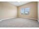 Spacious bedroom with carpet and window at 425 150Th Ave # 2401, Madeira Beach, FL 33708