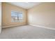 Spacious bedroom with carpet and window at 425 150Th Ave # 2401, Madeira Beach, FL 33708