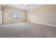 Bright bedroom with carpet and window at 425 150Th Ave # 2401, Madeira Beach, FL 33708