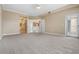 Large bedroom with carpet and access to balcony at 425 150Th Ave # 2401, Madeira Beach, FL 33708