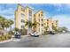 Condo building exterior showcasing its architecture and landscaping at 425 150Th Ave # 2401, Madeira Beach, FL 33708