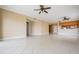Spacious living room with tile floors and ceiling fans at 425 150Th Ave # 2401, Madeira Beach, FL 33708