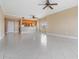Open living area with tile floors and kitchen access at 425 150Th Ave # 2401, Madeira Beach, FL 33708
