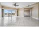 Bright living room with tile floors and access to balcony at 425 150Th Ave # 2401, Madeira Beach, FL 33708