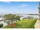 Stunning waterfront view with lush green lawn and marina at 425 150Th Ave # 2401, Madeira Beach, FL 33708