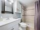 Updated bathroom with shower, toilet, and vanity at 4507 S Oak Dr # P71, Tampa, FL 33611