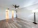 Well-lit bedroom with ceiling fan, wood-look floors, and a floor lamp at 4507 S Oak Dr # P71, Tampa, FL 33611
