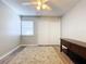 Well-lit bedroom featuring a double closet and ceiling fan at 4507 S Oak Dr # P71, Tampa, FL 33611