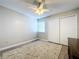 Bedroom with ceiling fan, wood-look floors, and area rug at 4507 S Oak Dr # P71, Tampa, FL 33611