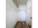 Walk-in closet with wire shelving and wood-look flooring at 4507 S Oak Dr # P71, Tampa, FL 33611