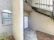 Condo building entryway with white door and exterior stairs at 4507 S Oak Dr # P71, Tampa, FL 33611