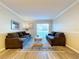 Spacious living room featuring sliding glass doors to backyard at 4507 S Oak Dr # P71, Tampa, FL 33611