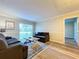 Living room with two sofas and a coffee table, access to hallway at 4507 S Oak Dr # P71, Tampa, FL 33611