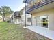 Private patio with sliding door access and grassy area at 4507 S Oak Dr # P71, Tampa, FL 33611