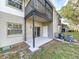 Private patio with sliding glass door and adjacent grass at 4507 S Oak Dr # P71, Tampa, FL 33611