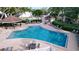 Inviting pool area with ample lounge chairs, tables, and a shaded gazebo at 4507 S Oak Dr # P71, Tampa, FL 33611