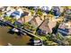 Aerial view of waterfront home with private dock and boat at 5606 Seagrass Pl, Apollo Beach, FL 33572