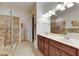 Elegant bathroom with double vanity, large shower, and walk-in tub at 5606 Seagrass Pl, Apollo Beach, FL 33572