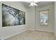 Bright bedroom featuring large artwork and window at 5606 Seagrass Pl, Apollo Beach, FL 33572