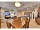Bright dining room featuring a wooden table and chairs, adjacent to kitchen at 5606 Seagrass Pl, Apollo Beach, FL 33572