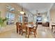 Spacious dining area with a wooden table and chairs at 5606 Seagrass Pl, Apollo Beach, FL 33572