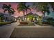 Beautiful one-story home with a landscaped yard and palm trees at 5606 Seagrass Pl, Apollo Beach, FL 33572