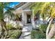 Front entry with a covered porch and landscaping at 5606 Seagrass Pl, Apollo Beach, FL 33572
