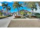 Well-maintained single-Gathering home with a two-car garage, manicured landscaping, and a welcoming entrance at 5606 Seagrass Pl, Apollo Beach, FL 33572