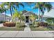 Charming single-story home with lush landscaping and inviting front porch, perfect for enjoying the Florida sunshine at 5606 Seagrass Pl, Apollo Beach, FL 33572