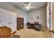 Home office with built-in shelving and two desks at 5606 Seagrass Pl, Apollo Beach, FL 33572