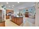 Modern kitchen with island, stainless steel appliances, and granite counters at 5606 Seagrass Pl, Apollo Beach, FL 33572