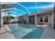 Inviting screened pool with ample deck space for lounging at 5606 Seagrass Pl, Apollo Beach, FL 33572