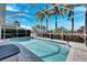 Sparkling screened-in pool area, an ideal oasis for relaxation and entertainment in a private outdoor space at 5606 Seagrass Pl, Apollo Beach, FL 33572