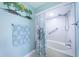 Bathroom with tub and shower, and coastal decor at 5901 Bahia Del Mar Cir # 321, St Petersburg, FL 33715